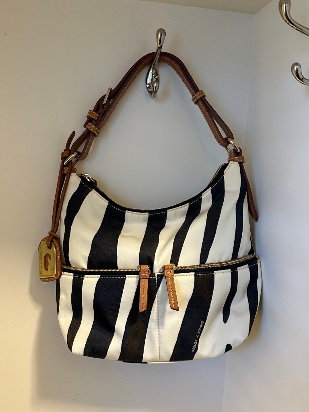 Dooney & Bourke shoulder bag with zebra stripe exterior and red interior